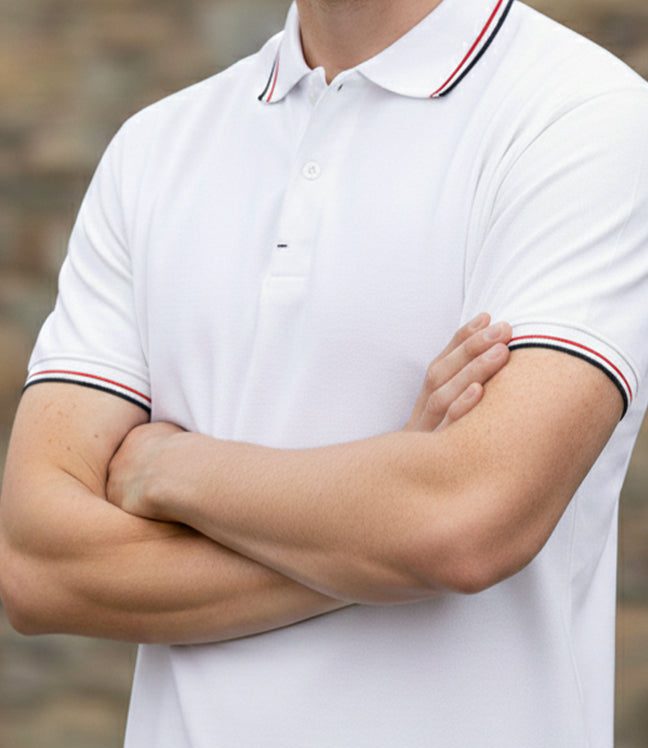 Close-up of a white organic cotton pique polo with tipped collar