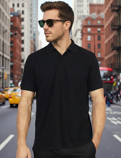 Man in a black bamboo polo on a city street