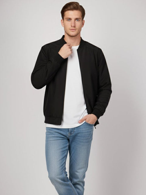 Man in a black Velora bomber jacket